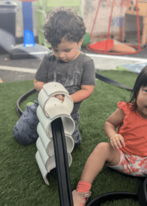 Pillar Kids Playing A Stacking Activity 