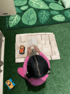 Toddler Playing With Wooden Blocks