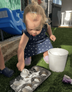 A Toddler Engaged In A Play-Based Learning Activity