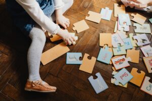 Toddler Working On A Puzzle