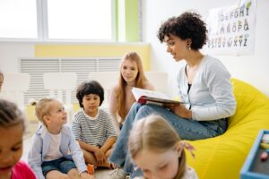 Woman-Reading-A-Book-To-The-Children